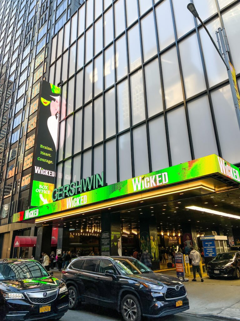 Exterior of Gershwin Theatre in New York City with signs for the hit Broadway show Wicked