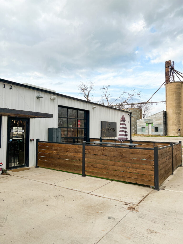 Front exterior shot of Little Wooden Penguin, a bar and shop in Celina TX, the perfect stop on day trips from Dallas.
